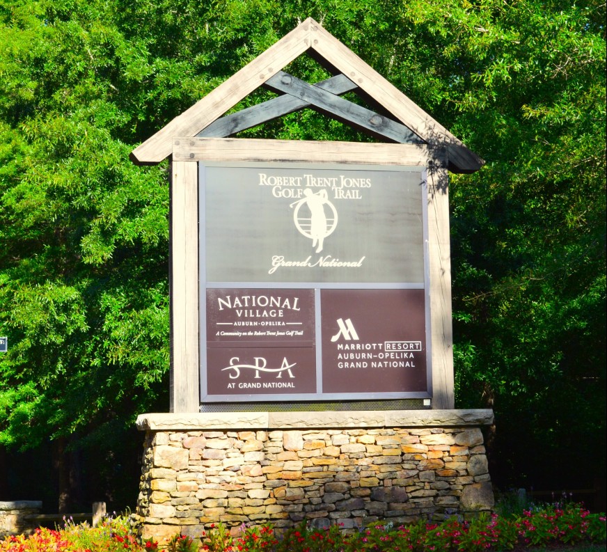 Sign for Grand National Golf and Spa, and National Village near top chiropractor Auburn, AL. Perfect spot for relaxation and wellness.