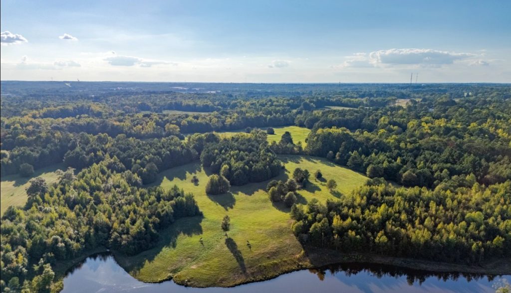Aerial view of lush green landscapes Ridge Road Opelika, AL, home to expert chiropractor services.